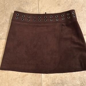 BCBGMaxazria. Soft faux suede lined  skirt with cool grommet accents.